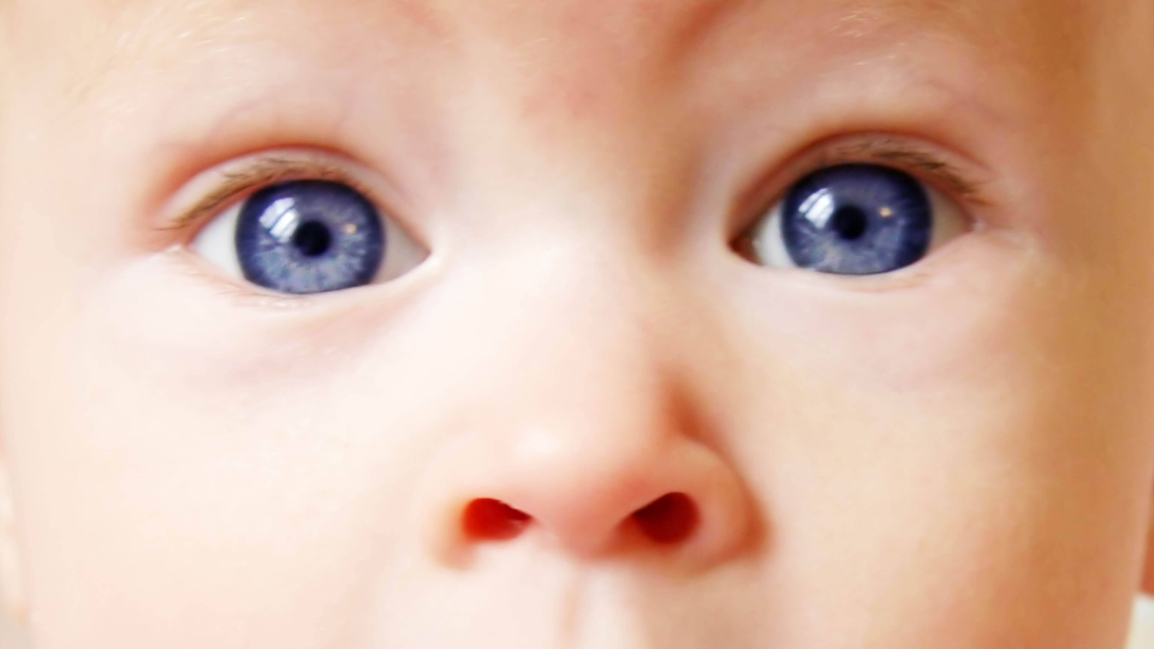 half black half white baby with blue eyes